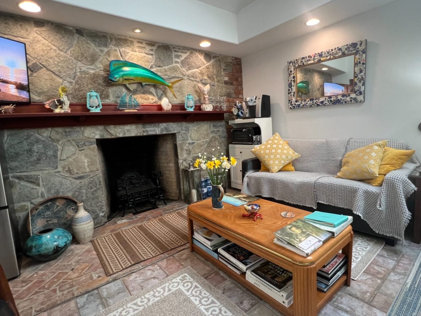 Guest Suite Living Area and Stone Fireplace Historic Rumford stone fireplace and cozy living room sitting area inside the luxury guest suite at Wind in the Willows Oasis.